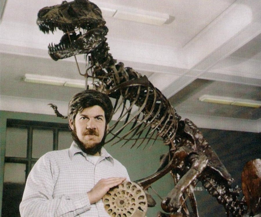 Steven Jay Gould holding a fossil