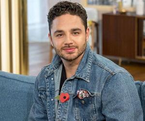 Adam Thomas Biography